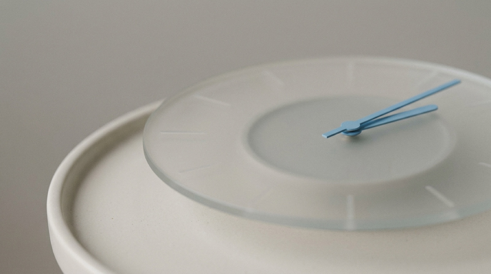 A soft, semi-transparent clock face on a calm off-white surface, its far side gently fading out of focus, with one sky-blue hand still sharp.