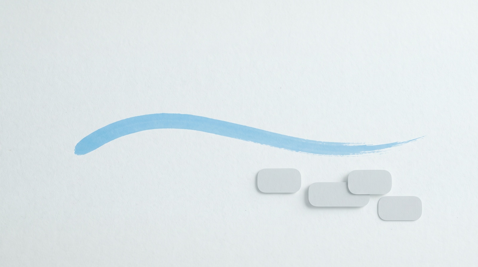 A single confident sky-blue brush stroke, like one handwritten mark, curving across a clean off-white surface with a few faint soft-grey tiles settling beside it.