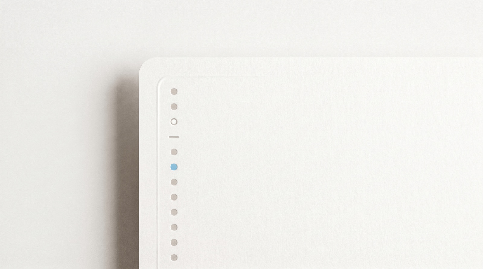 A tidy vertical column of soft bullet marks on a clean off-white field, one dot in sky-blue, resting inside the rounded corner of a faint card, like a paper list becoming a calm app.