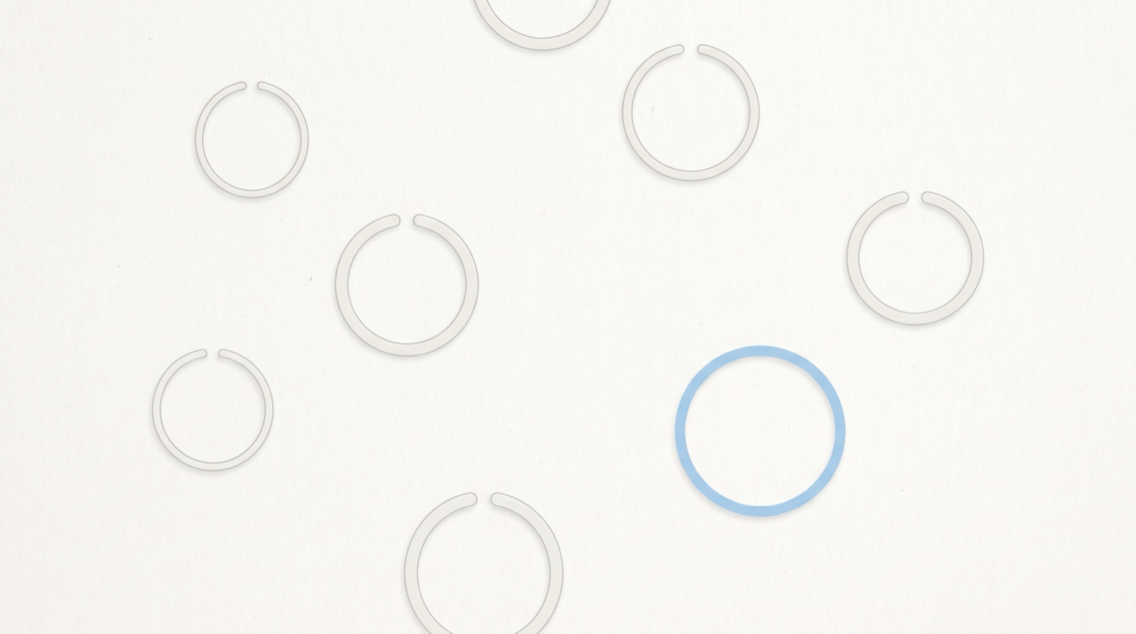 Several thin pale-grey rings scattered across a calm off-white surface, each one broken open at a gap, with a single sky-blue ring joined into a complete circle.